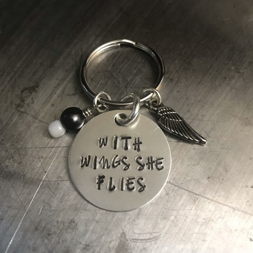 With wings she flies keychain